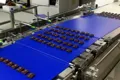 Sistema automático de envasado de obleas rellenas y chocolate