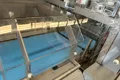 Envasadora horizontal flow pack SF-DH3 con sellado recíproco y alimentación inferior de film