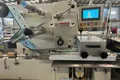 Envasadora horizontal flow pack SF-G sin bandeja con sistema multiservo para galletas en posición vertical